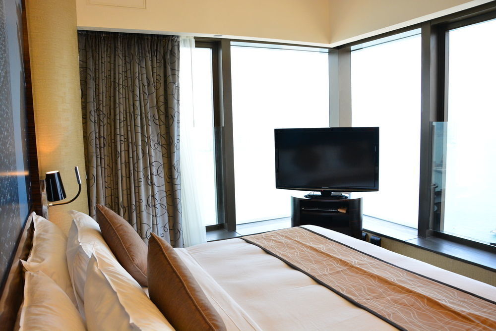 Harbour Grand Hong Kong Hotel Exterior photo A television in a hotel room
